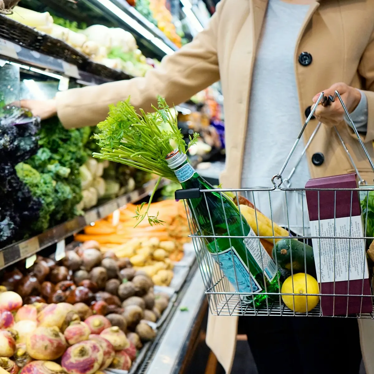 Shopping basket filling up in the produce aisle